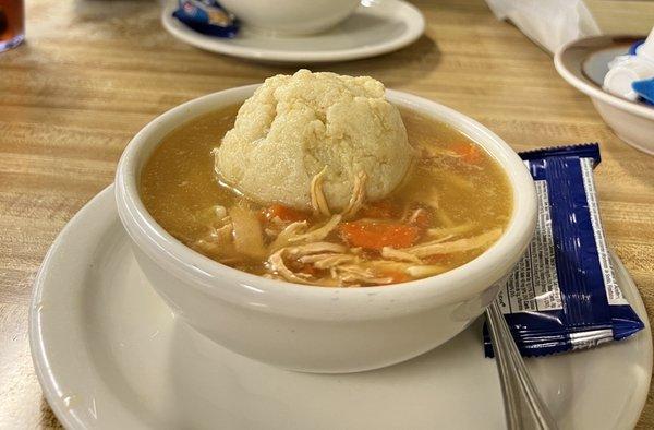 Matzo ball soup with real shredded chicken and not uniformly square pieces of chicken. Broth and Matzo ball were perfect.