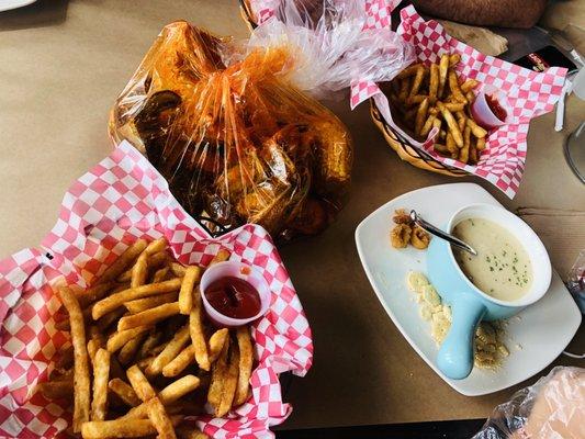 Seafood boil combo D with snow crab, shrimp, mussels and Cajun fries house sauce medium heat, fried calamari, calamari, clam chowder