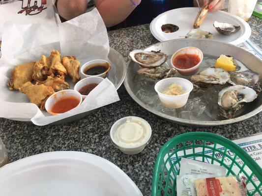 Wings cooked they way we asked, crispy with sauce on the side, and fresh raw Oysters