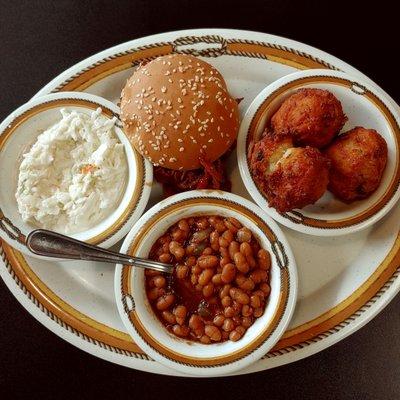 Sloppy Pig Sandwich, Baked Beans, Coleslaw, Hush Puppies