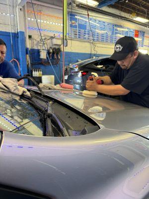 Team working on my car to correct the damage caused by Platinum