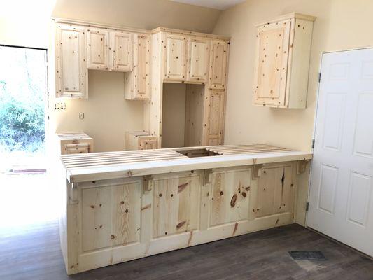 Knotty pine raised panel kitchen