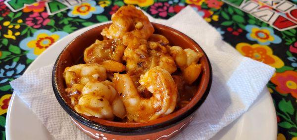 Garlic shrimp. The garlic itself tastes smooth not pungent, and the sauce is a bit charcoal flavor. Bread they provide perfect for dip.