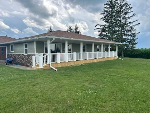 Raise the front roofline, tie in the new front deck and build the new covered deck.