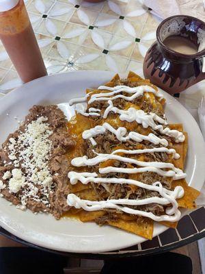 Chilaquiles with Carnitas added. So delicious