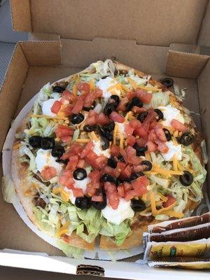 Small Taco Pizza To-Go, Delicious! but eat it fast before the lettuce has a chance to wilt.  Ask for taco sauce packets on the side