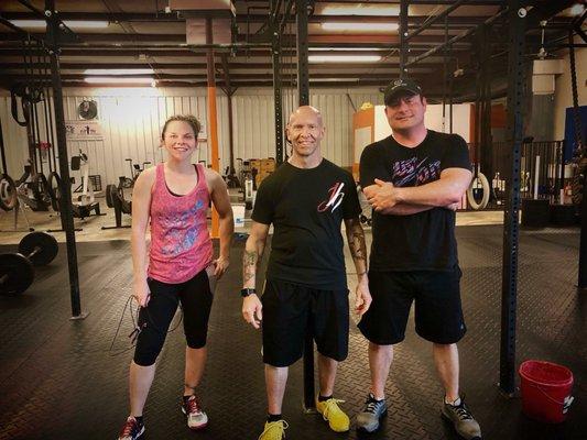 Coach/Owner Rainer and two grateful CrossFitters.