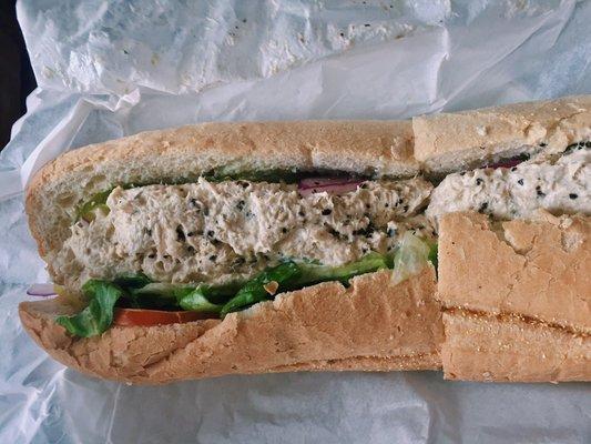 Tuna sub sandwich (includes lettuce, tomato, onions, pickles, vinegar, and salt n' pepper).