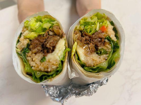 Our BOMB.COM Bulgogi beef Burrito; a perfect combo of savory/sweet. Comes with fried rice, mozzarella cheese, lettuce. Try & you'll love it!