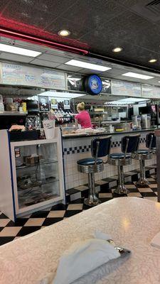 Diner interior. Food on counter was where waitresses were eating, facing customers