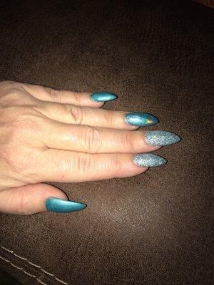 2 matte blue nails, one chrome Nail and 2 3-D Glitter nails!