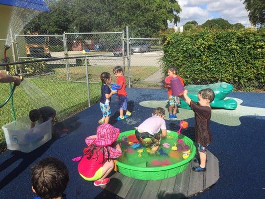 Summer Fun!! Our 2 year olds are enjoying some water play - pouring, splashing, spilling, and having a ball. =-)