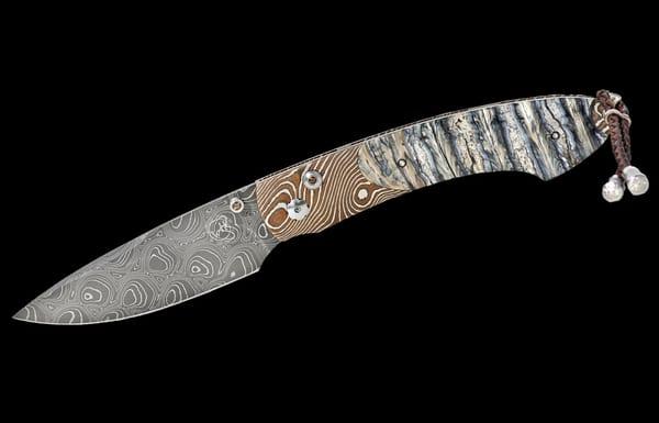 William Henry B12 Riptide Knife with fossil mammoth tooth inlay.