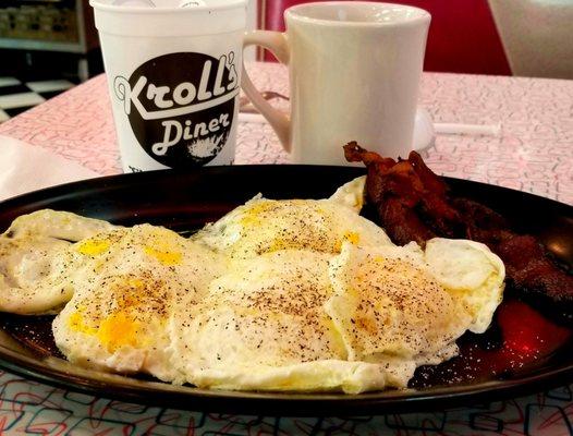 6 eggs over easy, 4 bacon, coffee and cream