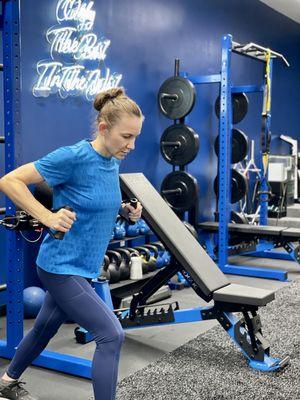 Victoria performing a chest press