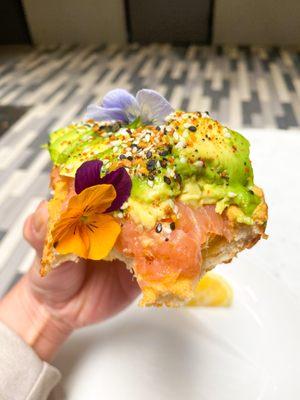 A bite into my delicious Smoked Salmon Avocado Toast