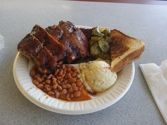 Ribs, sliced beef, potato salad, beans and condiments. Looks great!