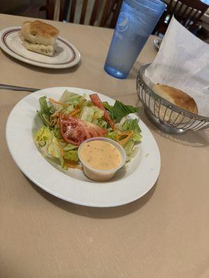 Salad with house dressing and the best garlic bread.