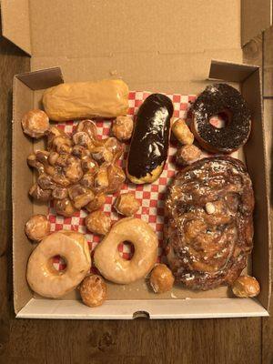 Cinnamon roll star, glaze, hot chocolate fritter, maple & chocolate long Johns, Oreo crumb donut, and donut holes.