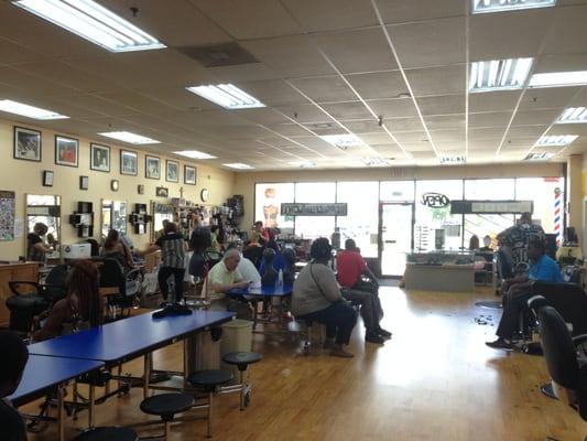 Saturday crowd, waiting for haircut.