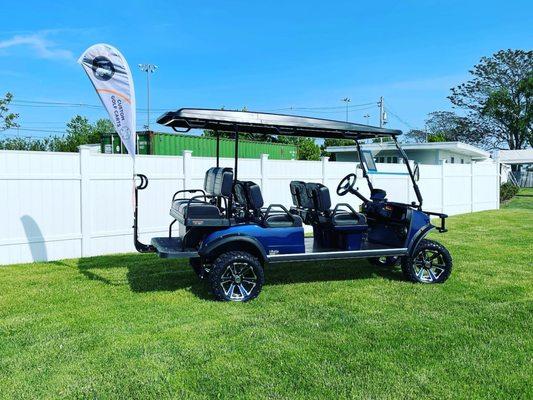 Check out this flagship Evolution 6-seater! This all-electric Golf Cart has plenty of room for family and friends to head out for adventure.