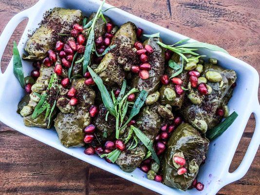 Dolmeh stuffed with rice and herbs and hand wrapped with fresh grape leaves