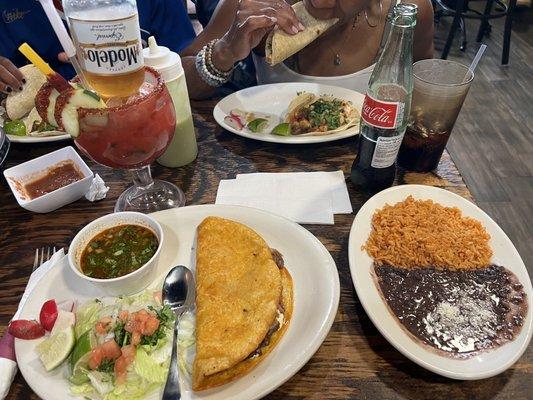 Rice and beans, quesabirria, shrimp tacos, veggie tacos, micheladas