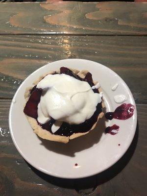 Strawberry/blueberry tart with fresh whipped cream.