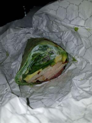 Turkey bacon avocado in a spinach wrap.