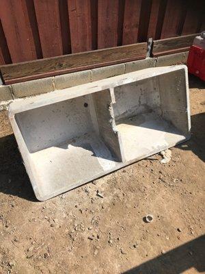 Old concrete laundry sink that had to be sledge hammered