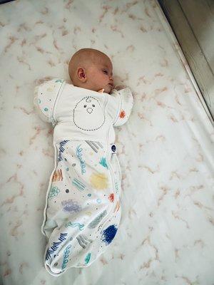 Doulas love to teach all about different swaddles and sleep sacks, and this little one loves them!