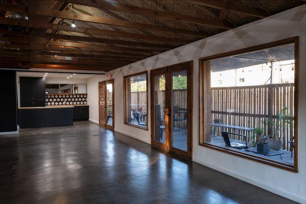 From front door, facing open kitchen, covered patio to the right