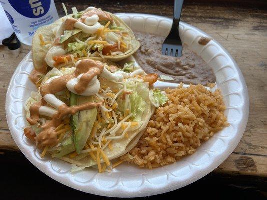 The number 14 on their menu.  Two Grande Shrimp Tacos 2 Shrimp Tacos served with Rice and Beans.