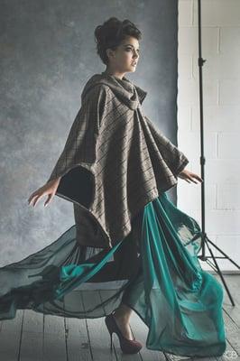 model, Livia Hope, in Kilika Couture Fall/Winter '15 oversize cowl neck poncho, and emerald chiffon gown.