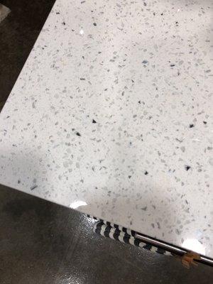 White granite countertops (same in bathroom). They glitter & are super easy to clean.