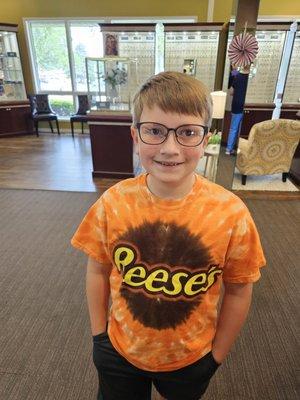 My son with his first pair of glasses.