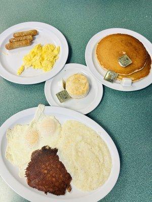 2 eggs with cornbeef hash, grits and biscuit Pancakes with eggs and sausage