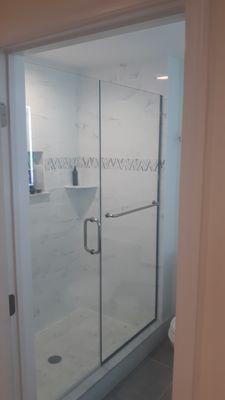 Custom Shower Door and panel installed with towel bar