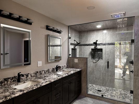 Two sink vanity with double shower heads, walk-in shower