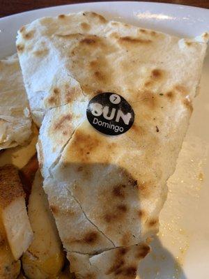 A sticker of some sort in my quesadilla...