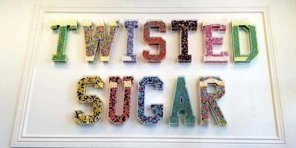 Twisted Sugars name filled with candy balls.