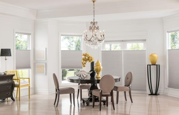 Top-down cellular shades allow just the right amount of light to shine through, while maintaining privacy in this dining room.