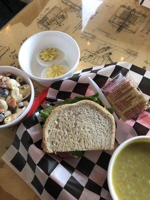 Homemade macaroni salad deviled eggs ham and Swiss on marble rye homemade split pea soup