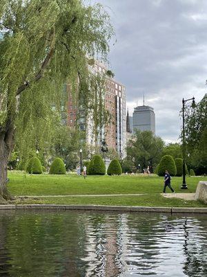 Riding in the Pedal Powered Swan Boats, cruising the Lagoon & Gardens, Skyline & island where Make Way for Ducklings live in Boston