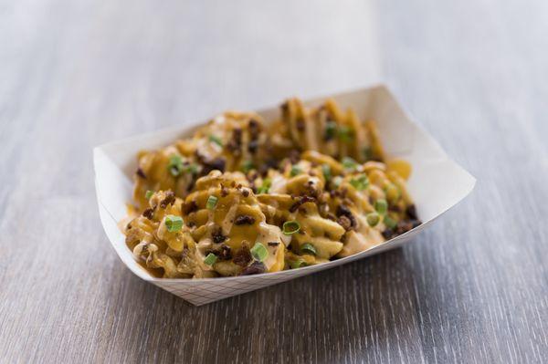 Party Fries (waffle fries, chipotle aioli, scallions, and bacon bits)