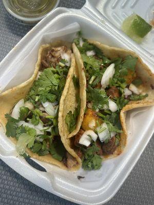 Carnitas taco and Al pastor taco