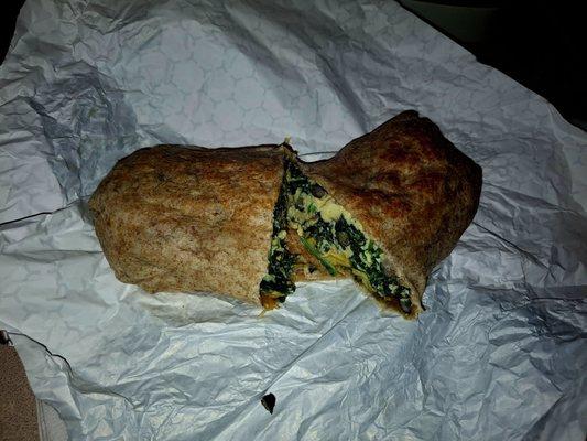 Create your own with spinach, avocado, black beans, cheddar, and tater tots in a whole wheat tortilla.