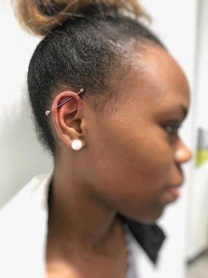 Pierced ear with jewelry. Almost Famous Body Piercing in Mankato, Minnesota.