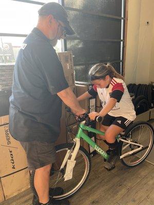 Patrick working with my daughter to make sure the seat height on her new bike was perfect!