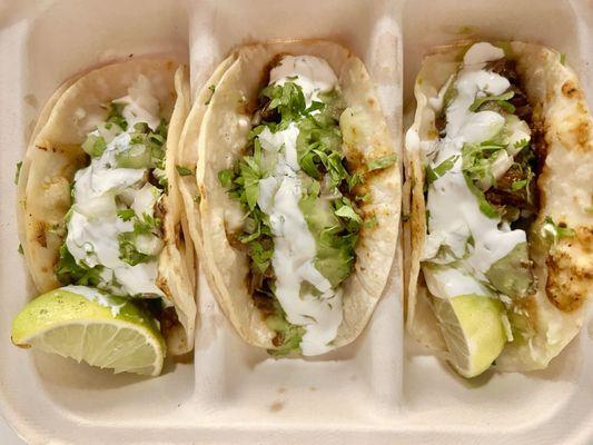 Barbacoa Tacos with guacamole salsa and sour cream